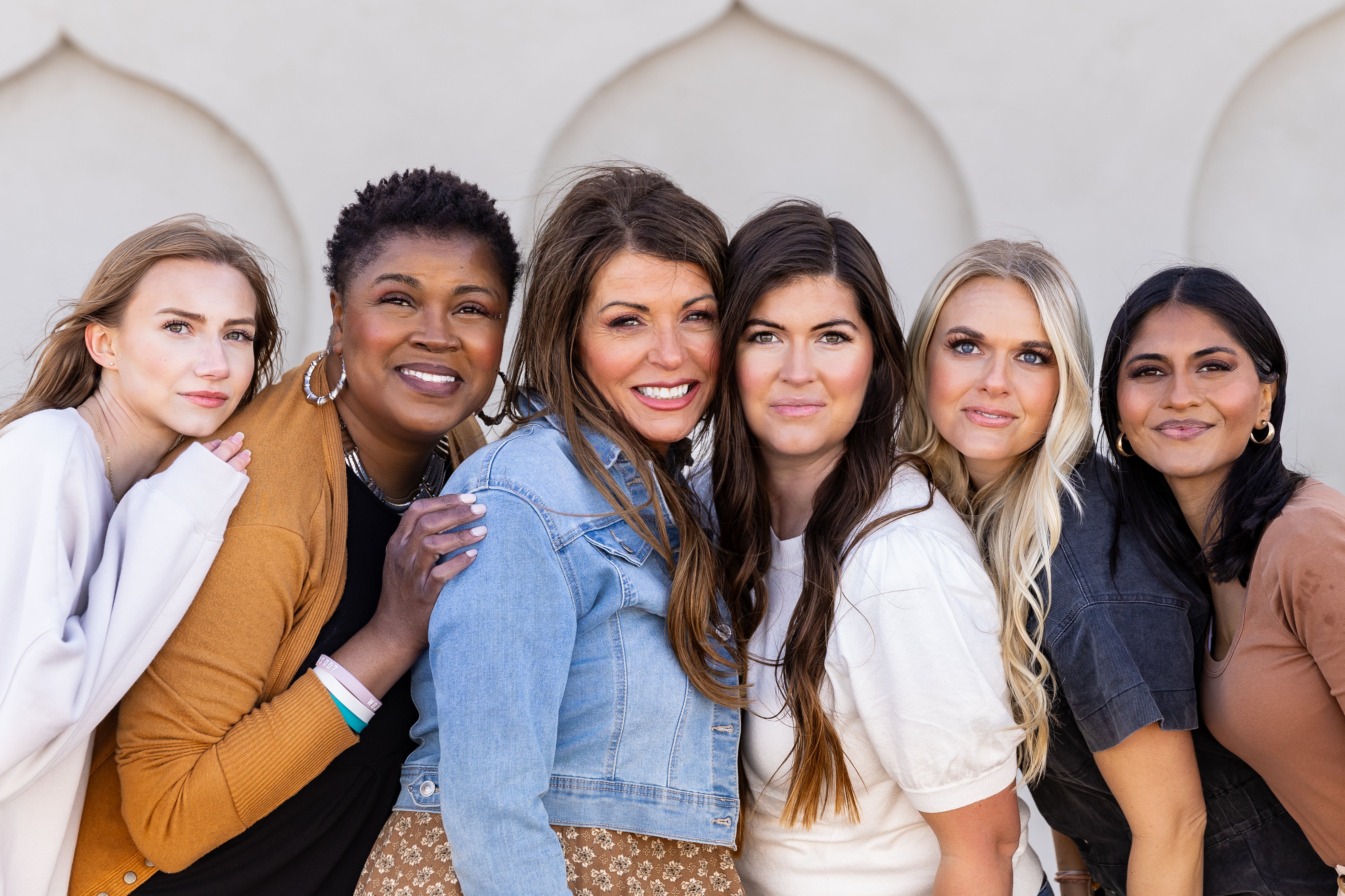 A line-up of PiperBlue Founder Jamie Jensen and CEO Cindy Yates with a group of women representing all women in our company