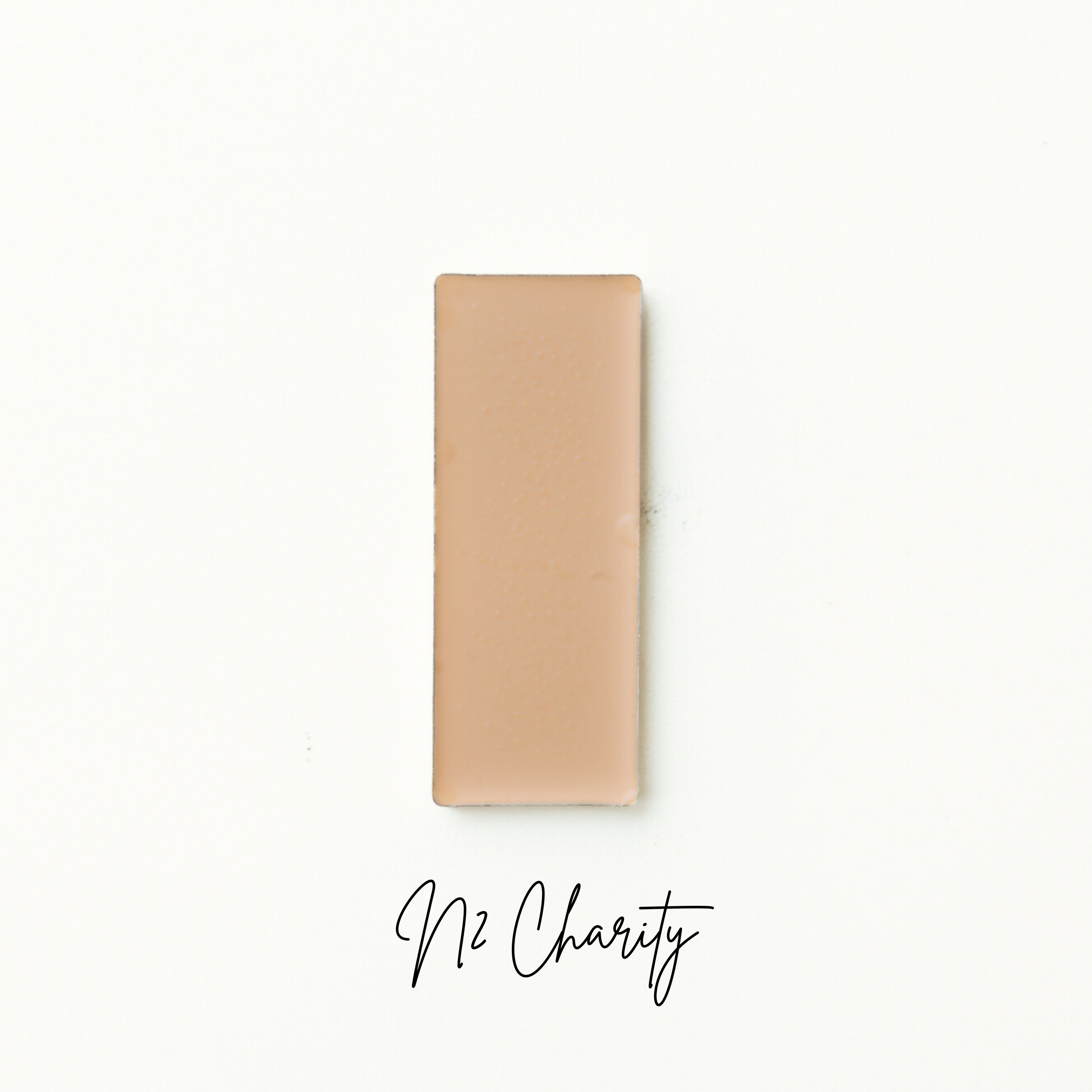 Beige wallet on a white background with 'No Charity' text. Natural Foundation