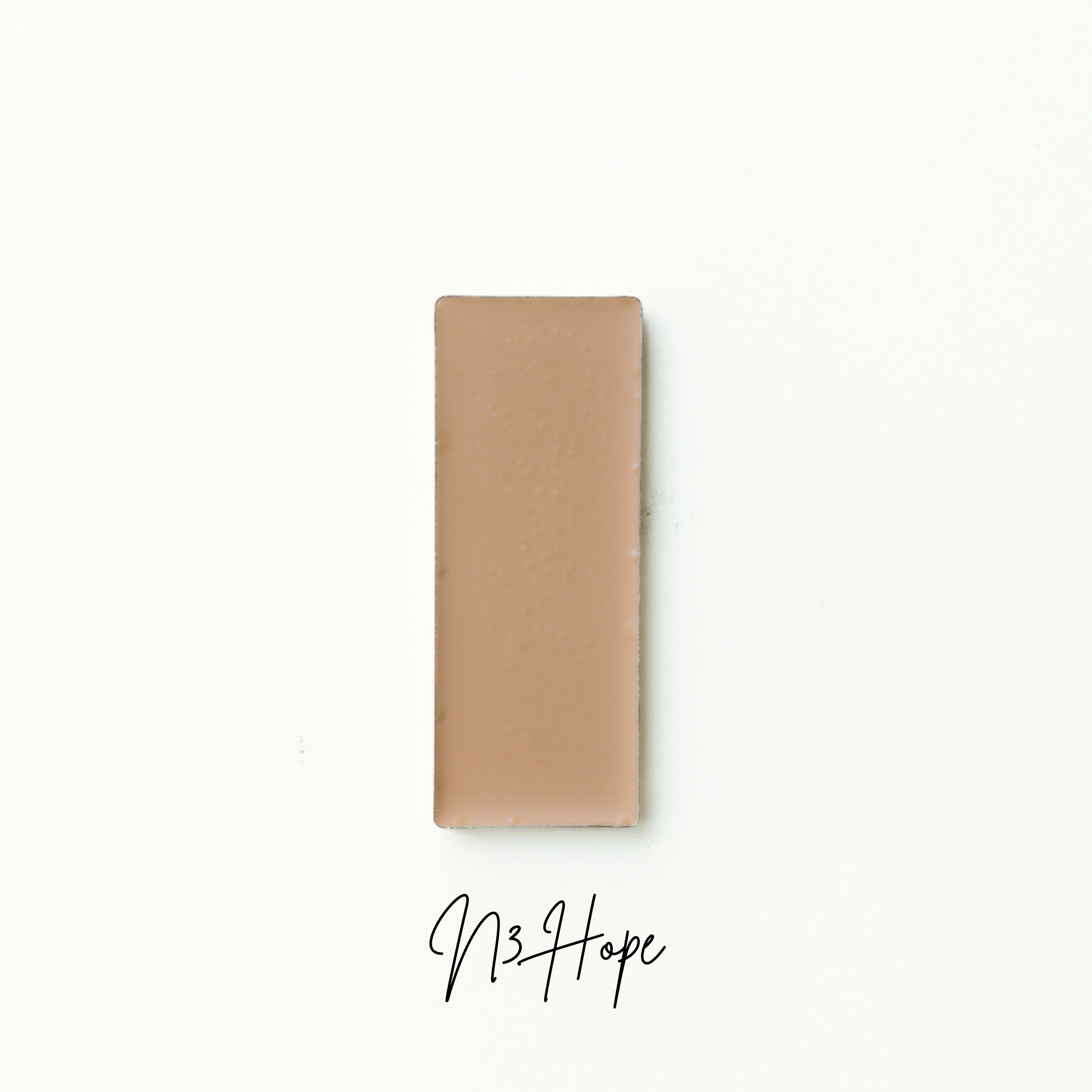 Rectangular brown object on a white background with 'N3 Hope' branding. Natural foundation