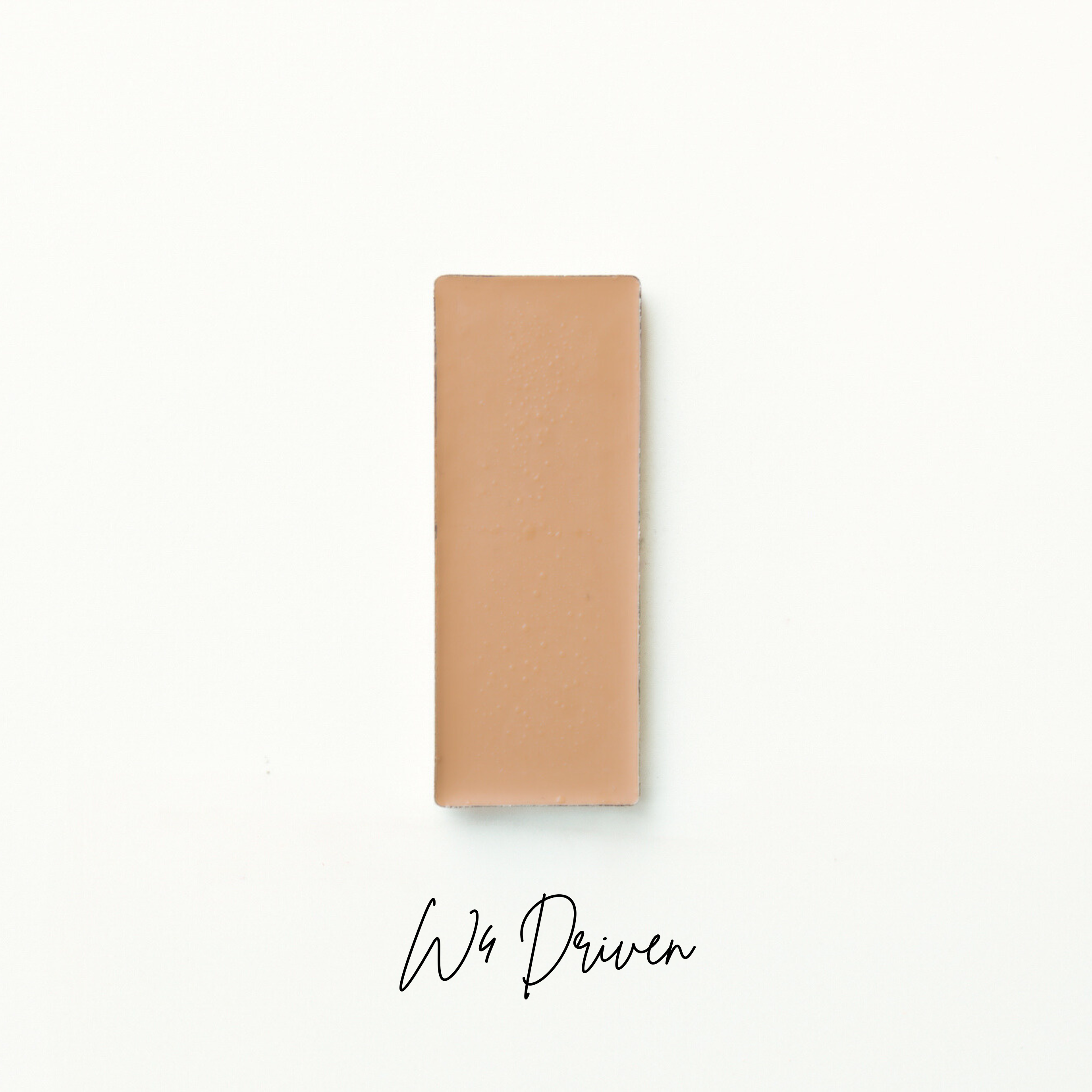 Rectangular brown object on a white background with 'We Driven'  branding. Natural makeup