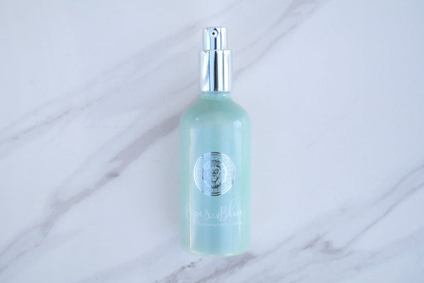Green Bottle with a silver spray top of Ageless Skin Cleanser / Makeup Remover 